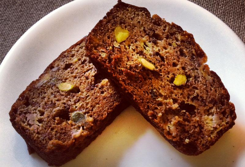 Two slices of paleo banana bread on a white plate