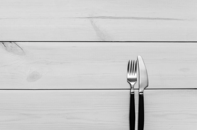 A knife and fork on a table